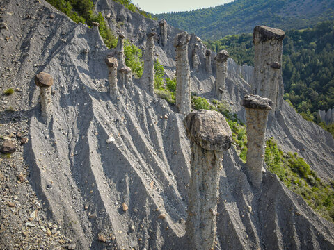 Aerial view of unique rock formations at Les Demoiselles coiffée in the mountains of the French Alpes