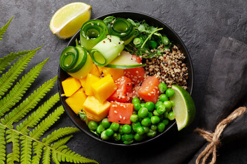 Poke bowl with salmon, cucumber and mango