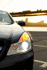 Fototapeta na wymiar Luxury black convertible car outdoors, closeup view