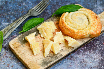 Fresh baked home made  Mini cheese puff pastries  and  italian parmesan cheese Cheese pie with phyllo pastry and herbs