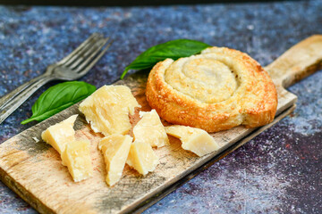 Fresh baked home made  Mini cheese puff pastries  and  italian parmesan cheese Cheese pie with phyllo pastry and herbs