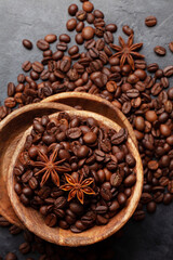 Roasted coffee beans in wooden bowl