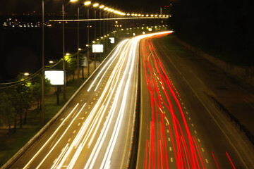 Fototapeta na wymiar Road with light trails in city, motion blur effect. Night life