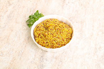 Grain mustard sauce in the bowl