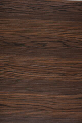 Fototapeta premium Smoked Oak veneer background in dark brown color, texture for unique home design.