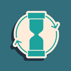 Green Old hourglass with flowing sand icon isolated on green background. Sand clock sign. Business and time management concept. Long shadow style. Vector