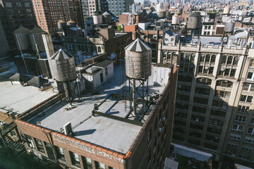 Wooden Water Towers on the Rooftops of Old Buildings of New York City, The New York City water...