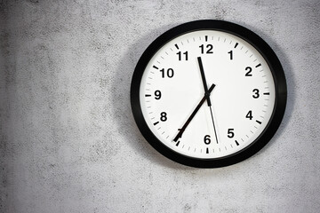 Wall round clock on a concrete wall. background with copy space.