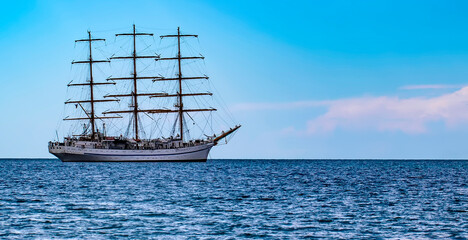 Fototapeta na wymiar Sailing ship in the sea without sails. Selective focus