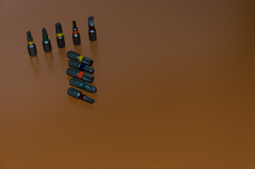 multi-colored bits from a screwdriver, tools for assembly, free space for insertion, selective focus