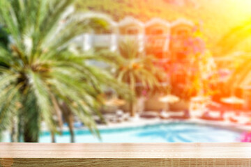Beach table background with blurred landscape of a summer tourist resort with a beach for relaxation and vacations.