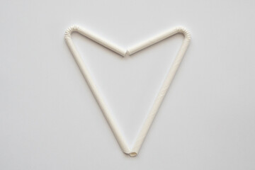 Biodegradable eco friendly white paper drinking straw on white background