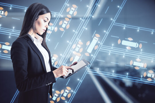 Sensing system and wireless communication network of vehicle concept with autonomous and driverless cars on digital scree controlled by businesswoman via digital tablet.