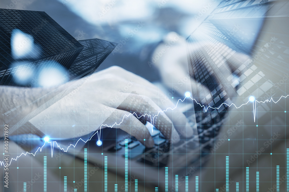 Poster close up of hands using laptop with forex chart on blurry desktop background. finance and trade conc