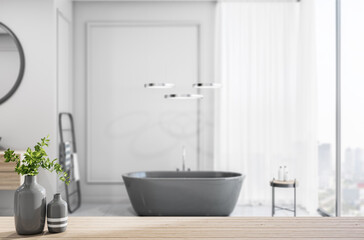 Naklejka na ściany i meble Light wooden bathroom countertop with vase on stylish sunny batroom background with black bath, light wall and city view from huge window. 3D rendering.