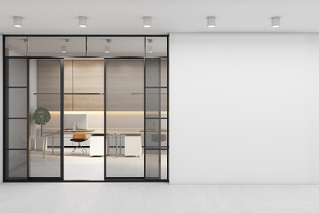 Blank light wall before the entrance to office area with work places, wooden wall and stylish tables with modern laptops. 3D rendering, mockup