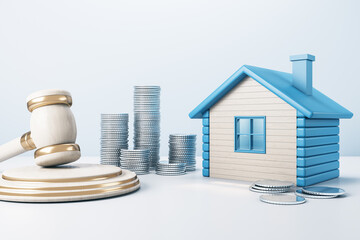 Blue house with golden coin stacks and gavel on concrete background. Divorce and property division...