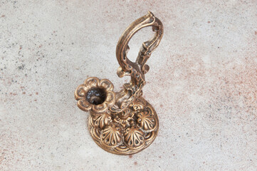 Antique candlestick on concrete background