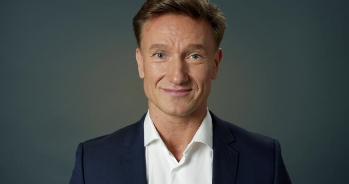 Handsome Successful Businessman Nodding his Head in Agreement at Camera Slow Motion. Smart Professional Manager Agreeing Smiling. Confident Leader Posing. Close-up Happy Face Adult Male Portrait.