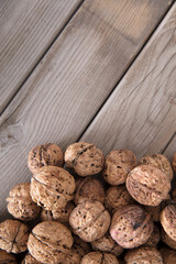 Dried walnuts on wooden background