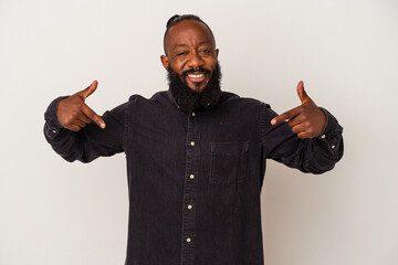African american man with beard isolated on pink background points down with fingers, positive feeling.