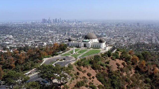 Arial, epic view of the Los Angeles cityscape and Griffith Observatory, drone view
