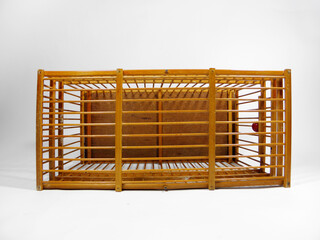 Bird cage made of bamboo on white background