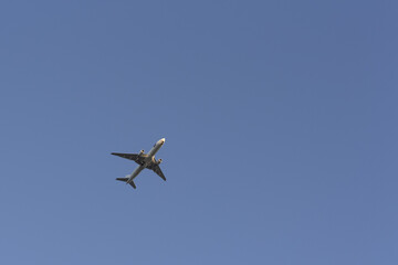 Airplane in the sky. Clear, cloudless sky. Air travel.