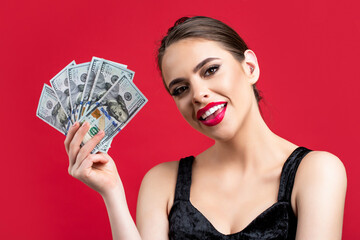 Woman with dollars in hand. Portrait woman holding money banknotes. Girl holding cash money in dollar banknotes. Woman holding lots of money in dollar currency. Luxury, beauty and money concept