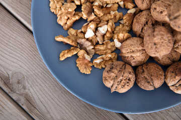 Walnuts and walnut kernels on the plate