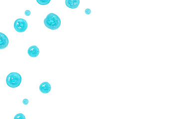 Transparent blue gel drops on white background, top view
