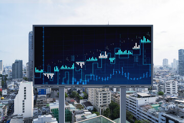 Forex and stock market chart hologram on road billboard over panorama city view of Bangkok. The...