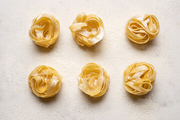 Homemade tagliatelle pasta onmarble board. Traditional Italian food concept