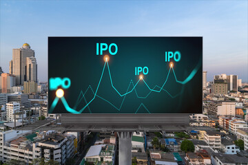 IPO icon hologram on road billboard over sunset panorama city view of Bangkok. The hub of initial...