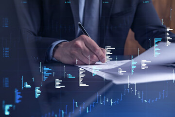 A client in formal wear is signing the contract to invest money in stock market. Internet trading...
