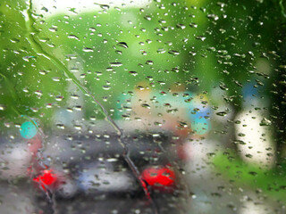 Raindrops on the windshield of the car. Blurred image.