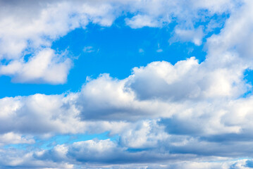 Naklejka na ściany i meble blue sky with white beautifull clouds background.closeup