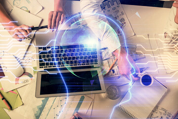 Double exposure of man and woman working together and brain drawing hologram. Intellectual brainstorming concept. Computer background.