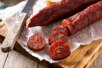 Spanish chorizo sausage on rustic wooden table