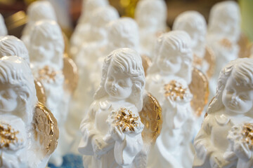 Fototapeta na wymiar many bright angels. a gift for children who receive the first holy communion