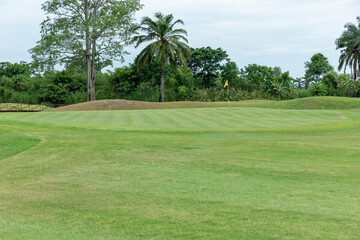 Golf course has a wide area. with beautiful green grass