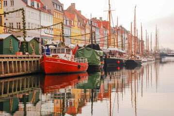 traditional houses and yacht of Nyhavn pier (New Harbour) during Christmas. Copenhagen, 