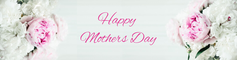 Bouquet of peonies on a white wooden background, happy mothers day