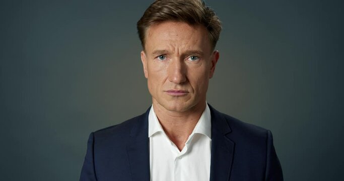 Handsome Successful Businessman Shaking his Head in Denial at Camera Slow Motion. Smart Professional Manager Refusing the Offer. Confident Leader Posing. Close-up Serious Face Adult Male Portrait.