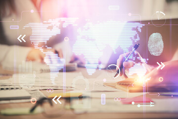 Double exposure of woman hands working on computer and world map hologram drawing. International technology business concept.