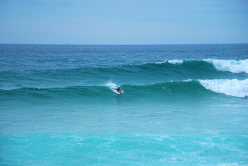 Fototapeta na wymiar Bodyboard surfer in a wave