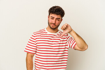 Young caucasian man isolated on white background showing thumb down, disappointment concept.