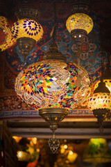 Middle Eastern lambas of different colors and sizes are hanging in the bazaar. Bright traditional...