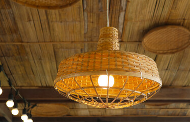 Wood pendant lamp traditional style installed on bamboo ceiling.