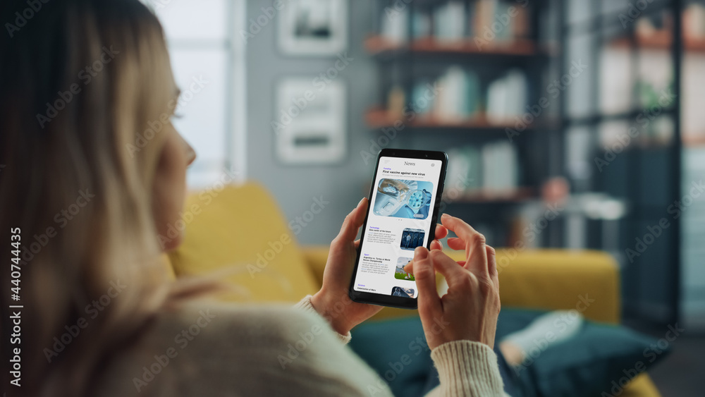 Poster beautiful authentic female using a smartphone for reading latest news and articles about technology.